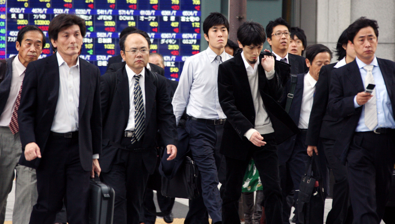 Trabajadores en Tokio. AP